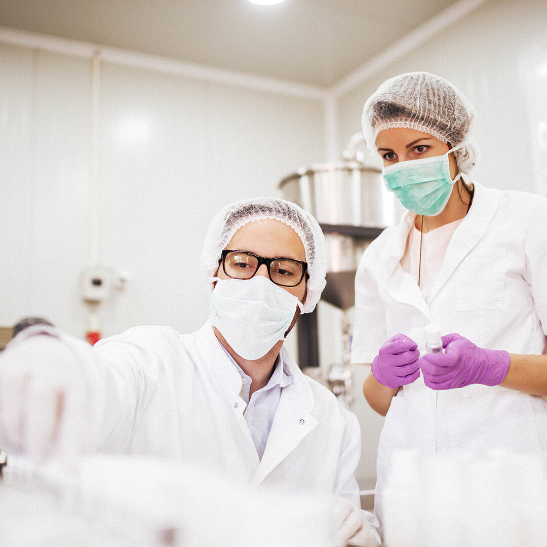 two scientists working in a lab two scientists working in a lab